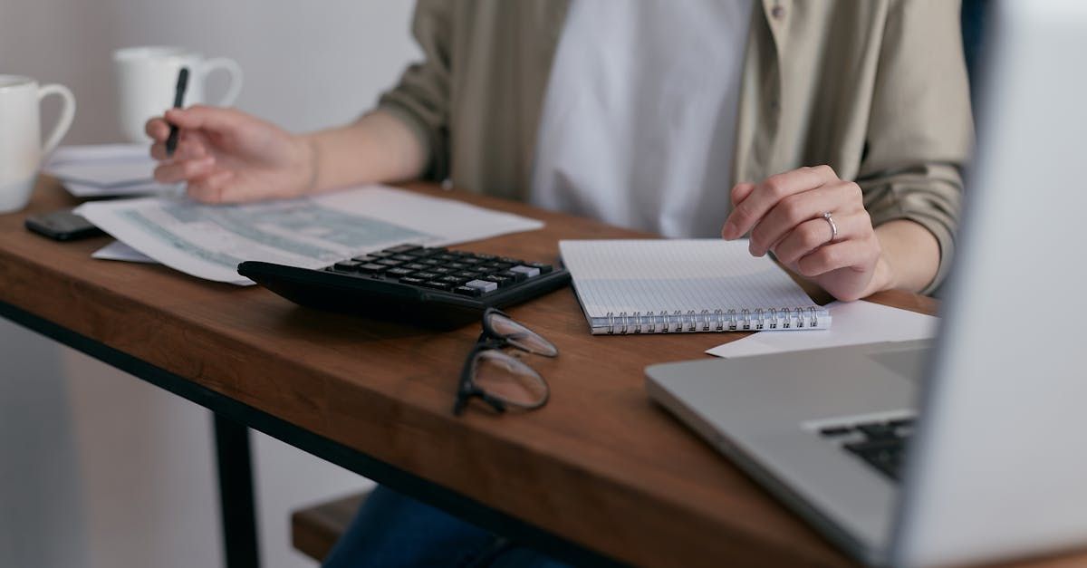 Couple at home desk discussing insurance add-ons